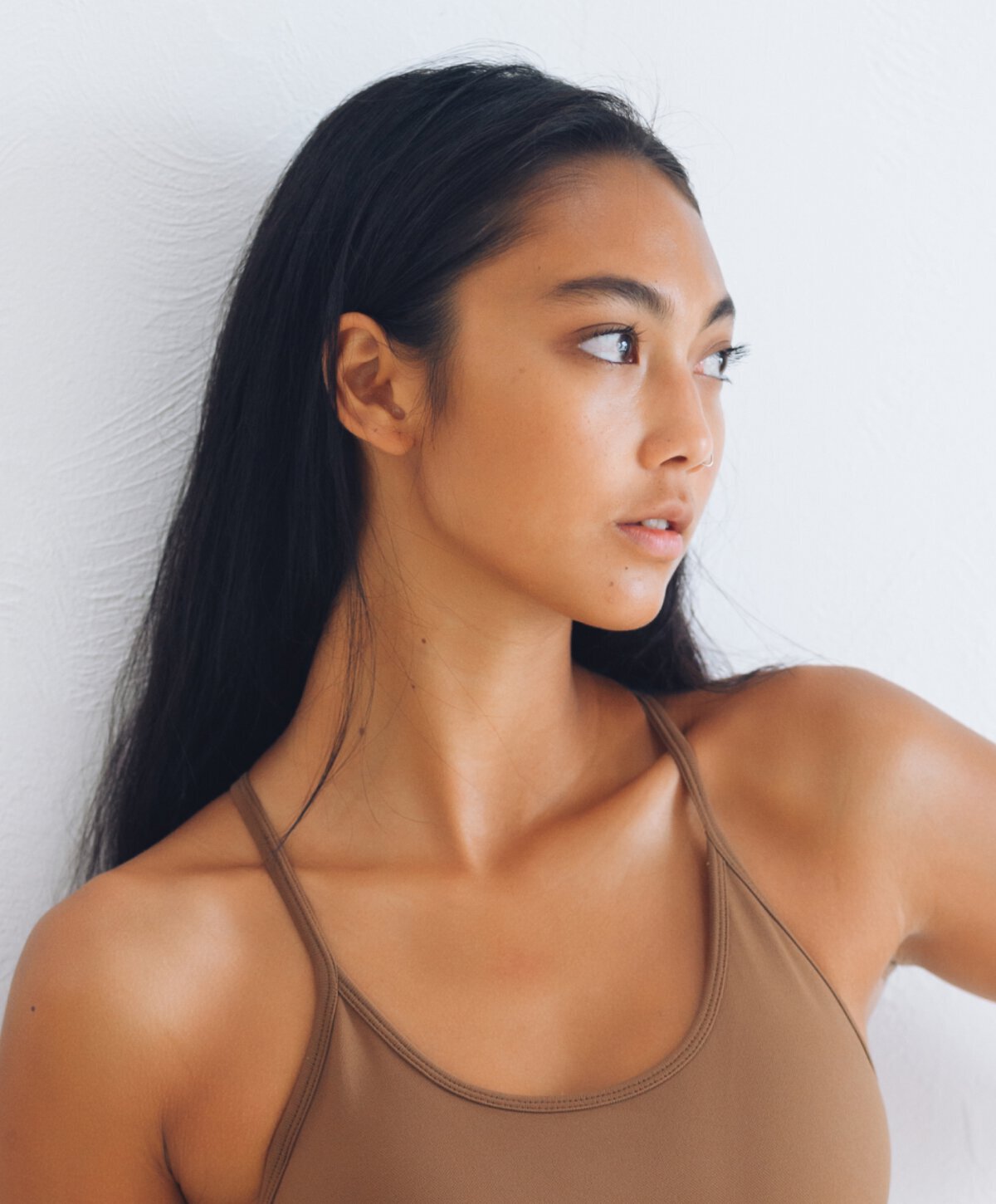 Ponte Vedra Beach Scar Revision model in a brown top